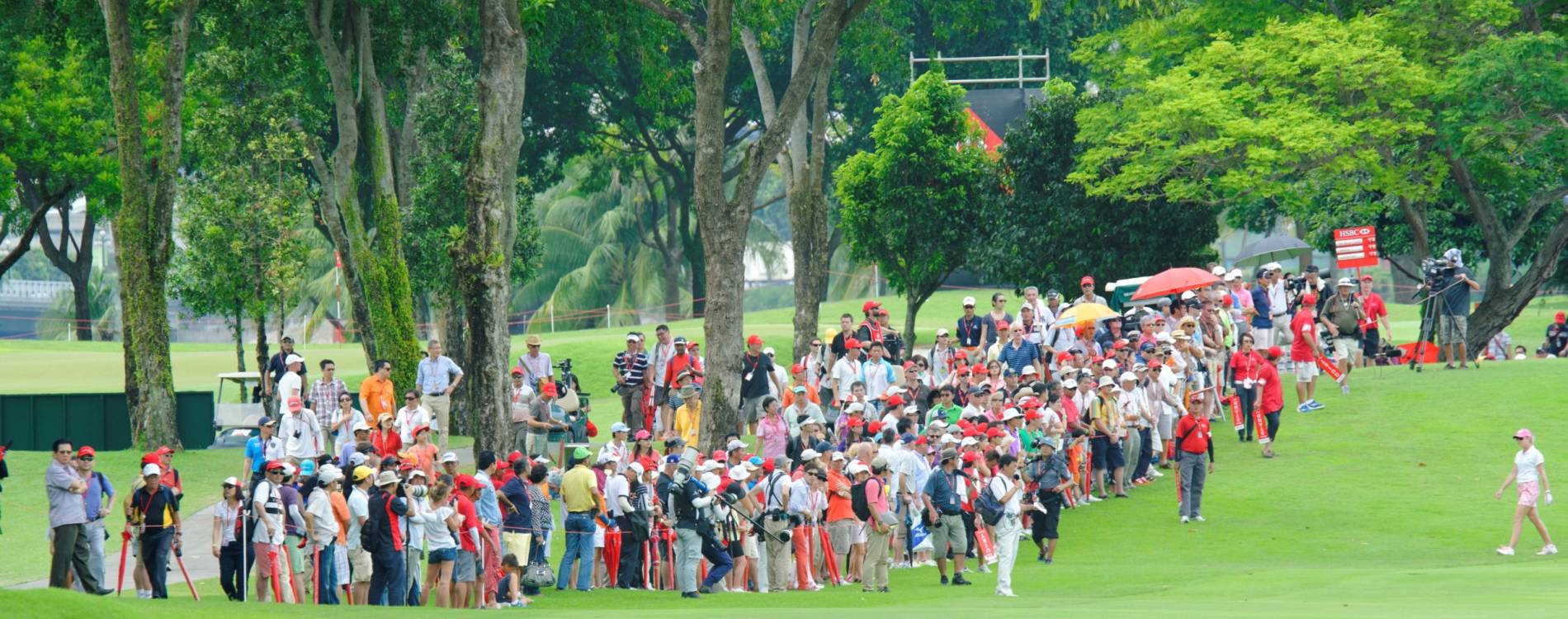 A crowd watches an LPGA event