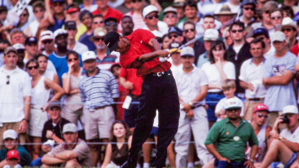 A crowd watches Tiger Woods tee off