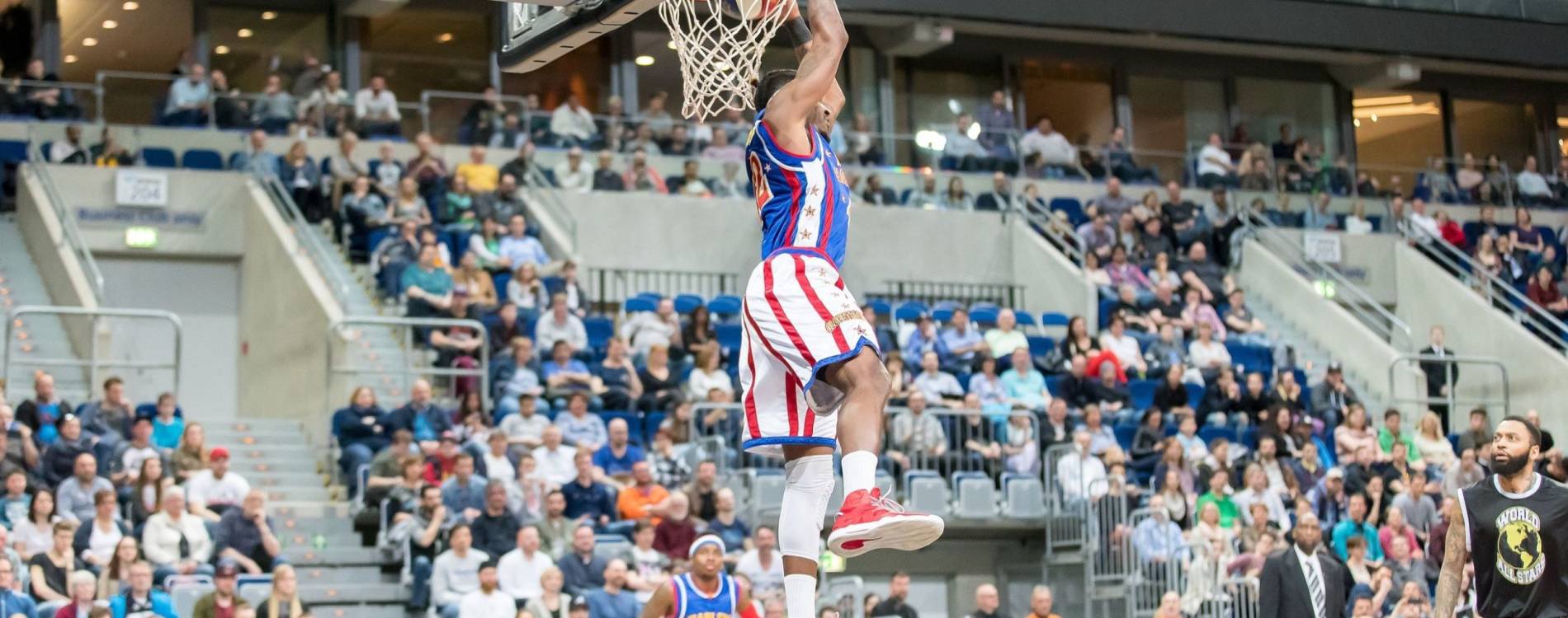 A Globetrotter makes a backwards dunk