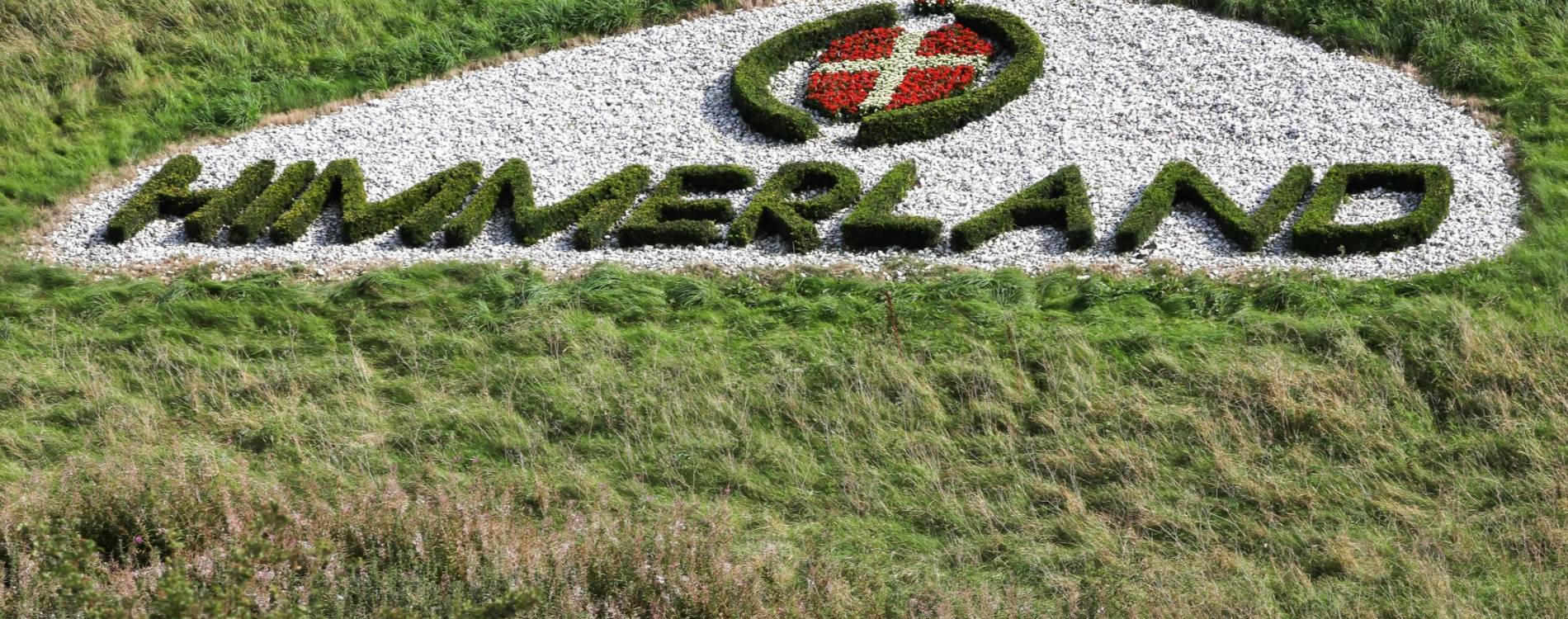 A HimmerLand sign in the grass