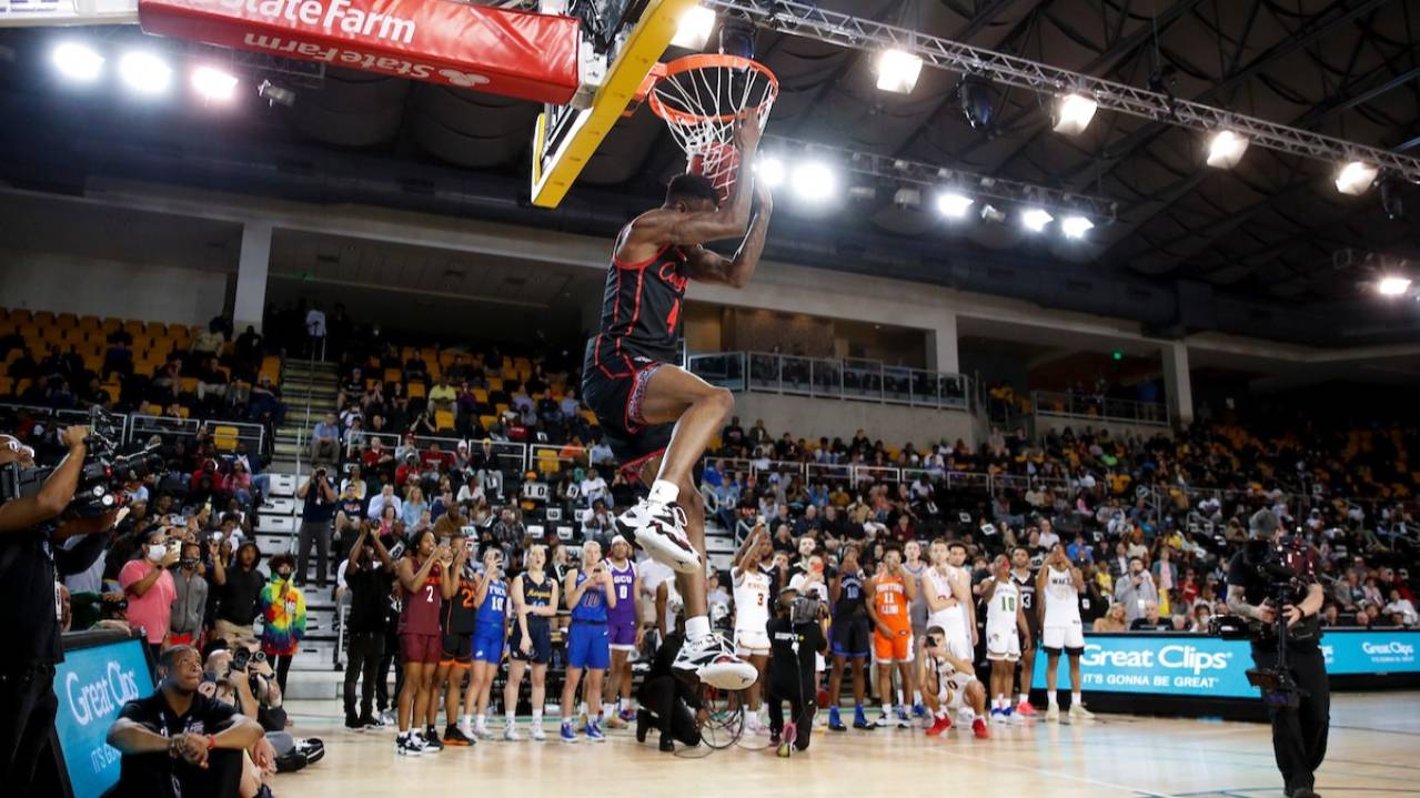 A player dunks the ball at the College Slam Dunk & 3-Point Championships