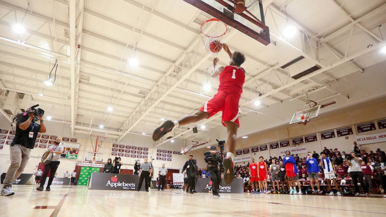A player dunks the ball at the College Slam Dunk & 3-Point Championships