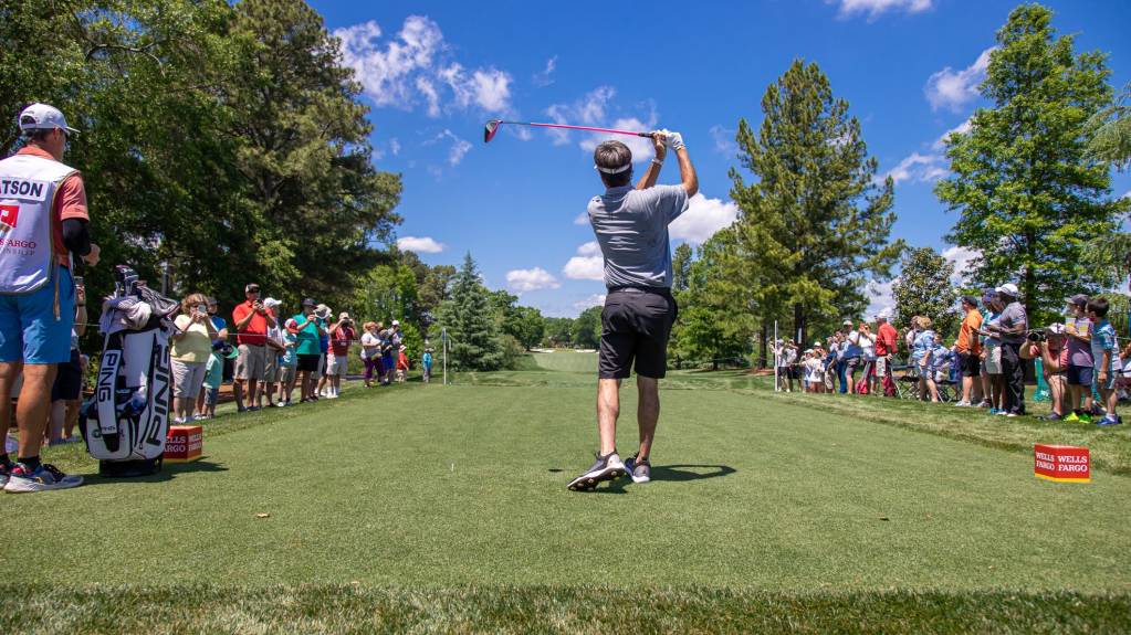A player tees off at the Wells Fargo Championship