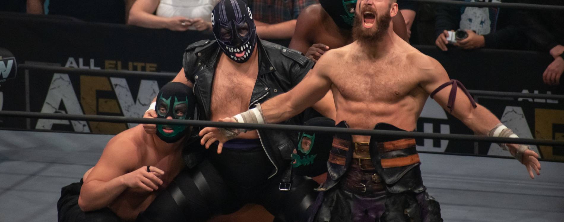 AEW's Dark Order strike a pose before a match