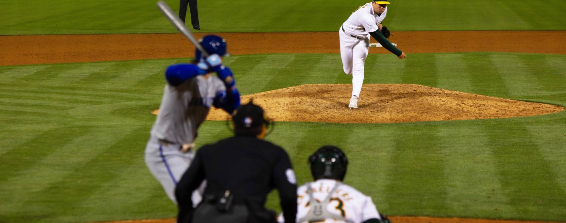 An Oakland Athletics pitcher sends down a pitch