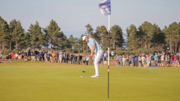 Bernd Wiesberger making a putt on the 18th green at the Scottish Open