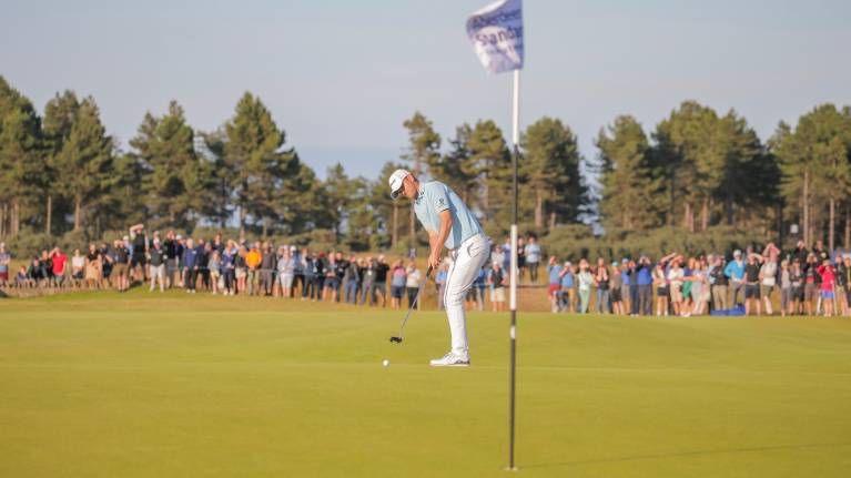 Bernd Wiesberger making a putt on the 18th green at the Scottish Open