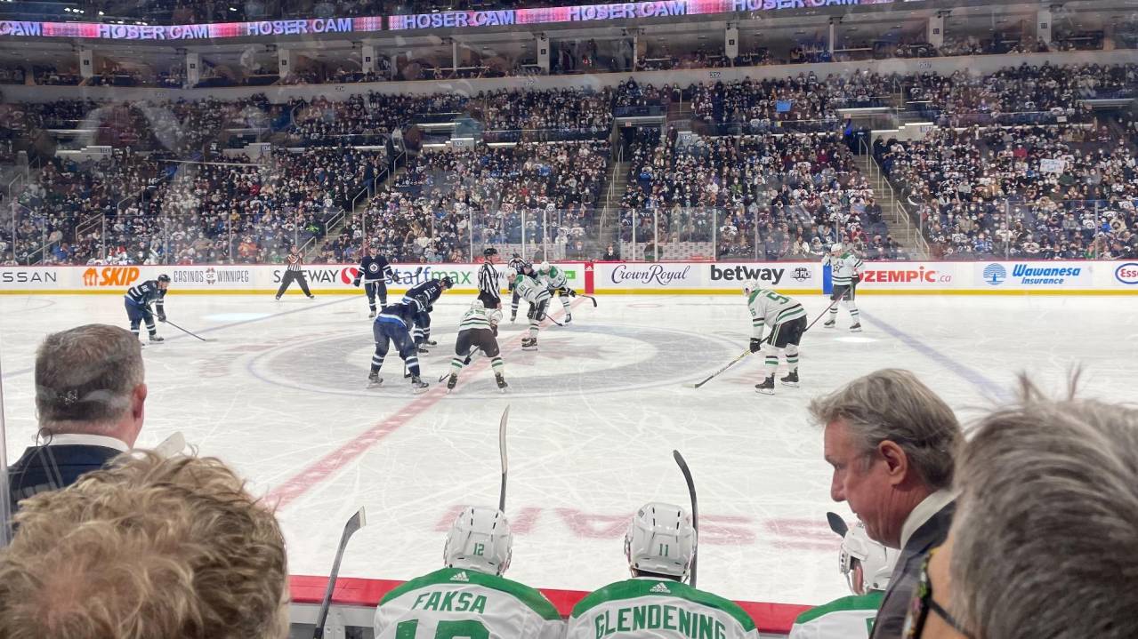 Between the Bench seats in Section 118