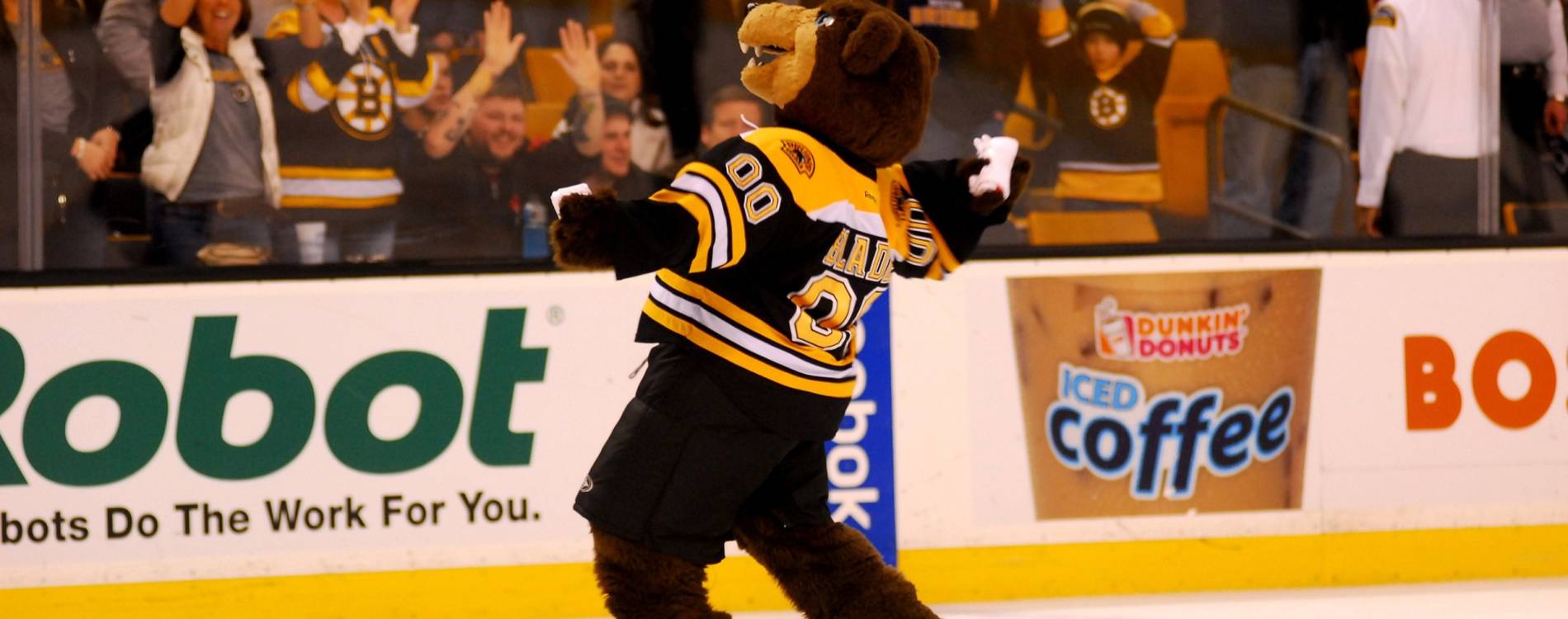 Blades the Bruin throws a T-shirt into the crowd