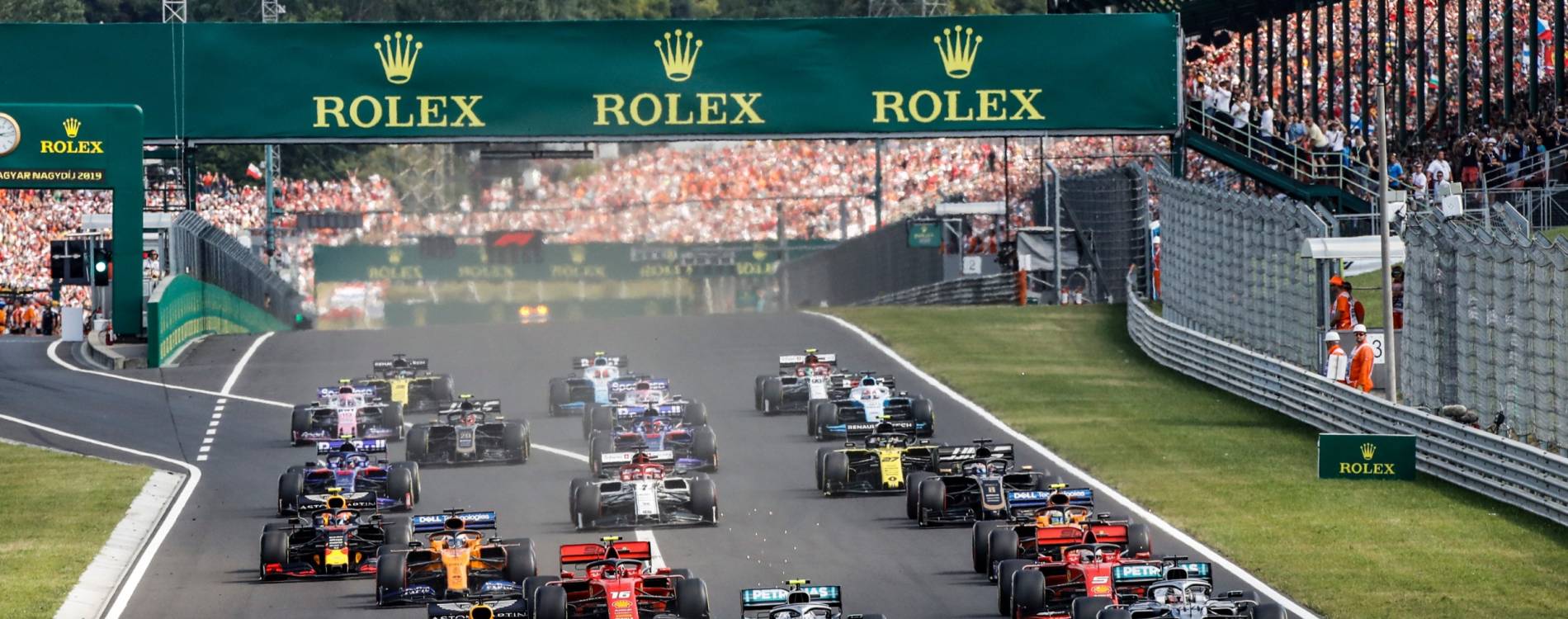 Cars speed down a straight at the Hungarian Grand Prix