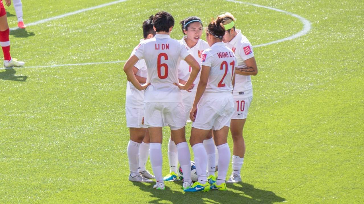 China women's football team huddle during a World Cup game