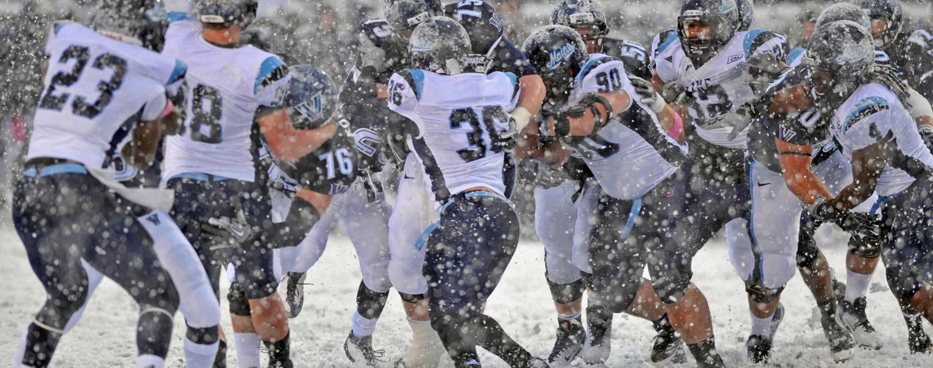 College football teams go head to head in the snow