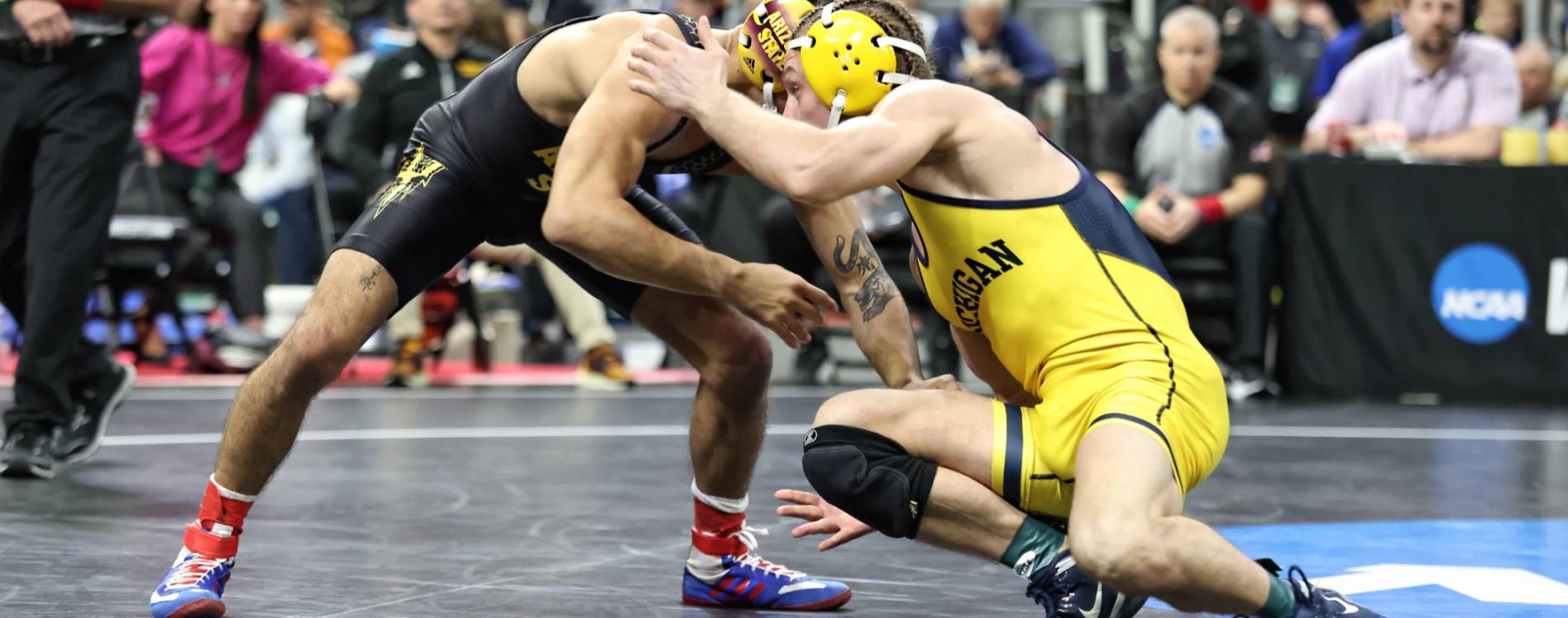 Competitors battle at the NCAA DI Wrestling Championships