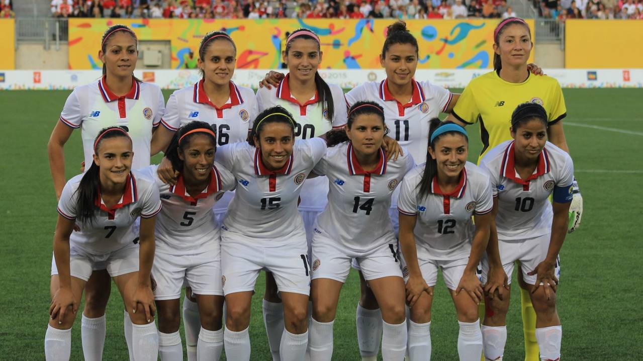 Costa Rica women's team pose for a photo before a game against Canada
