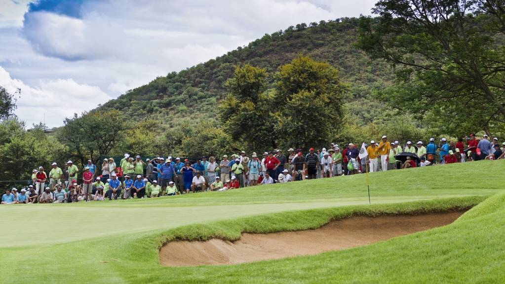 Crowds gather around a green at the Nedbank Golf Challenge