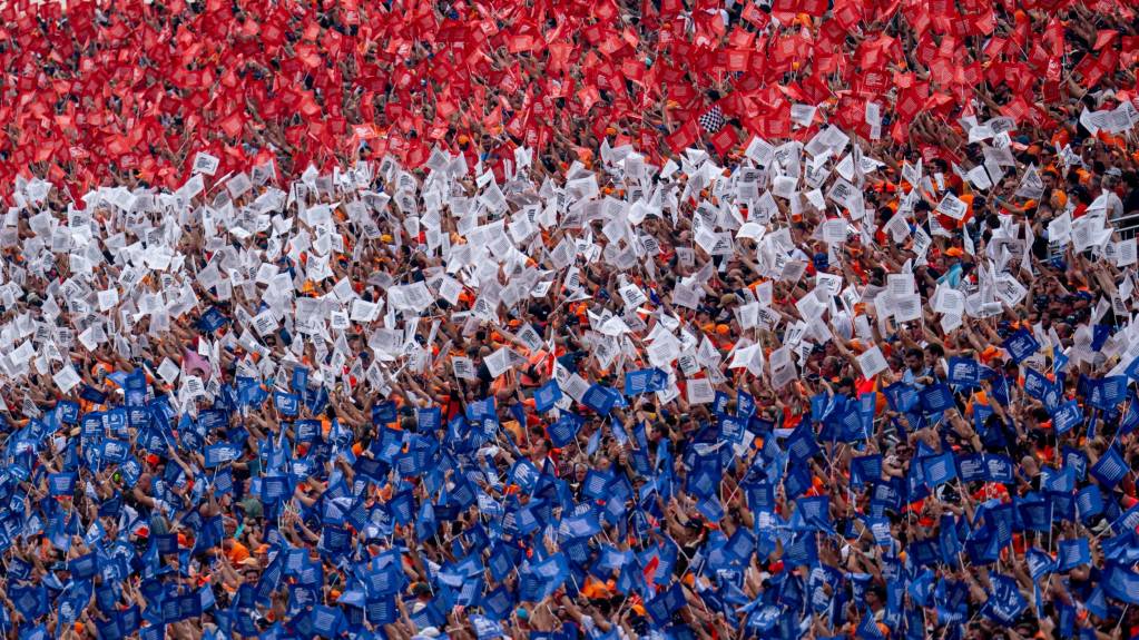 Dutch fans dressed in orange recreate the national flag