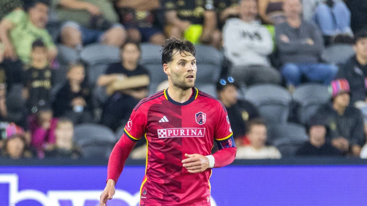 Eduard Lowen carries the ball for St. Louis City