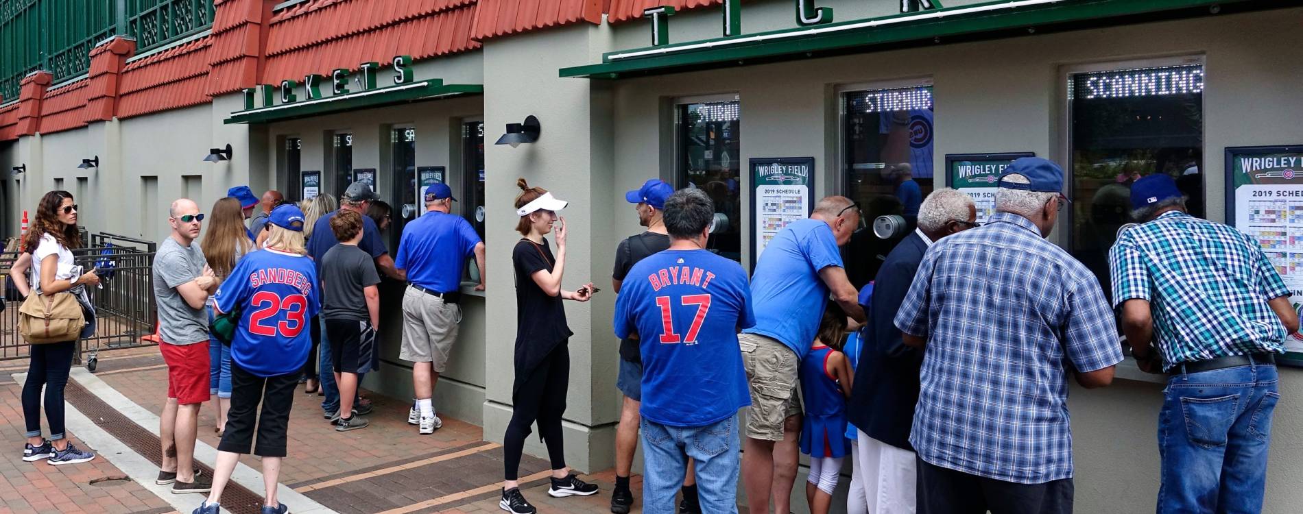 Fans collect tickets outside Wrigley Field in Chicago