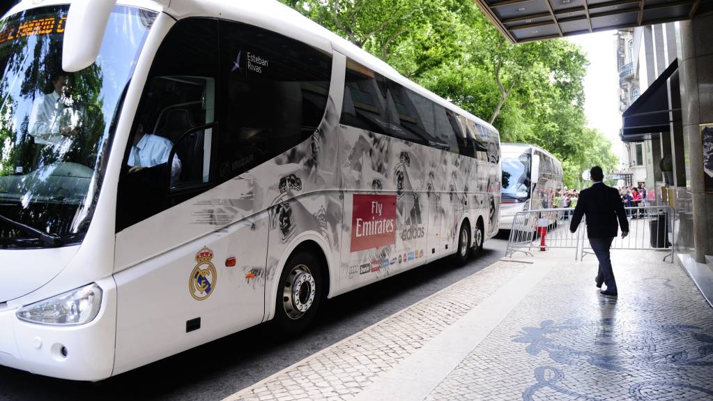 Fans wait outside Real Madrid's team hotel for autographs as they board the bus