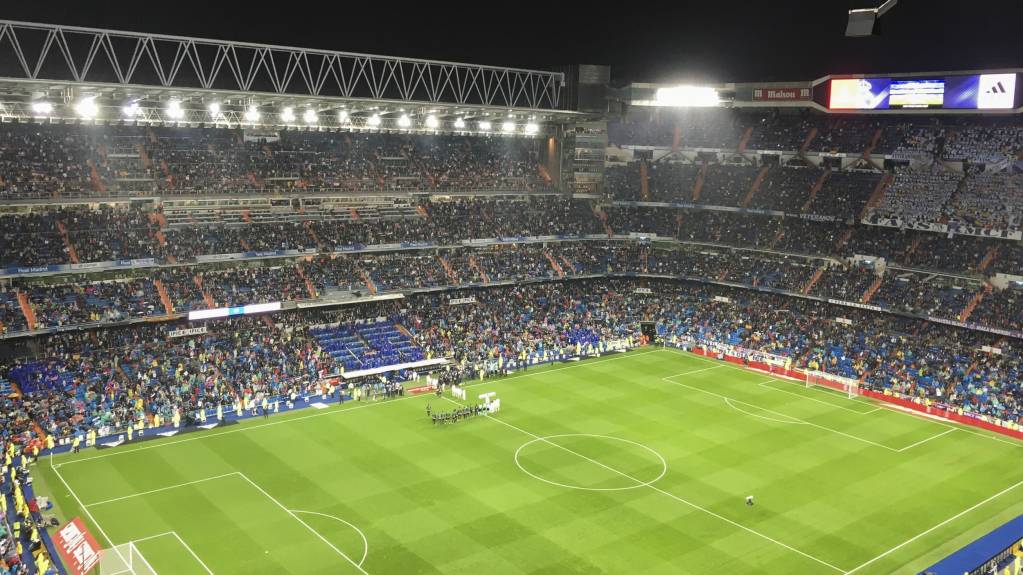 Fans watch El Clasico in the Santiago Bernabeu