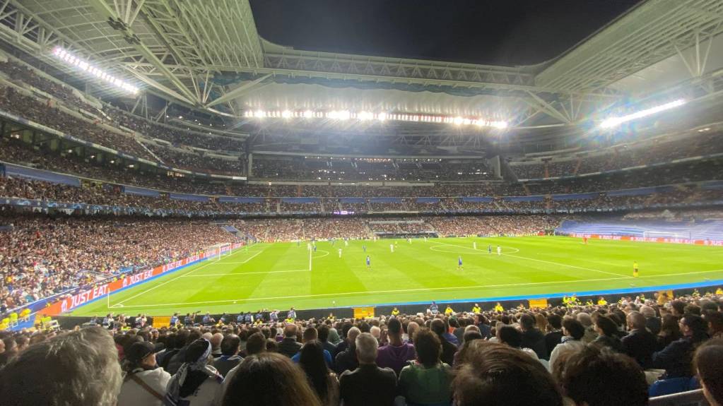 Fans watch Real Madrid face Chelsea at the Santiago Bernabeu