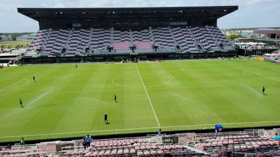 Groundsmen attend the DRV PNK Stadium pitch