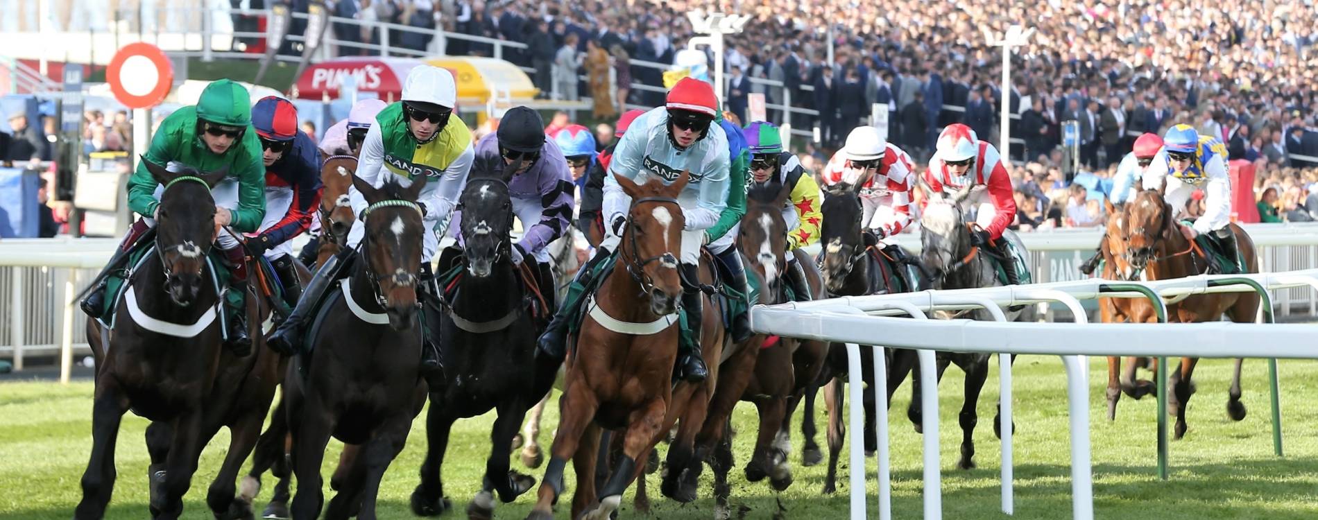 Horses tackle a bend at the 2022 Grand National