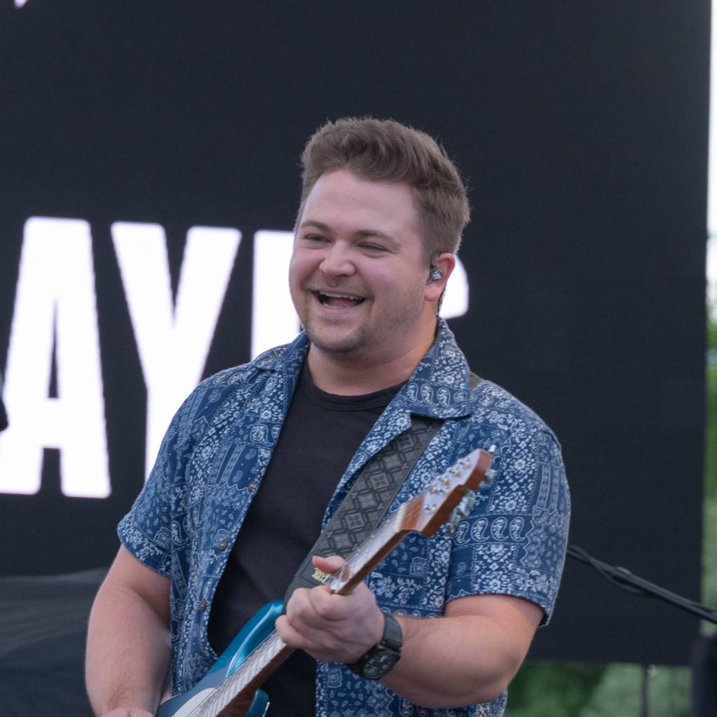 Hunter Hayes plays his guitar on stage during Patriot Fest at Peterson Space Force Base