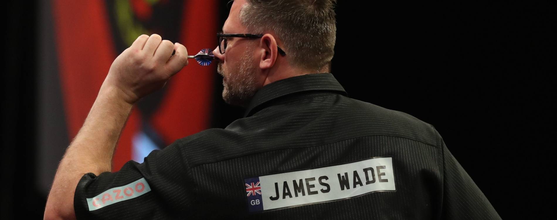 James Wade competes during a Premier League Darts event