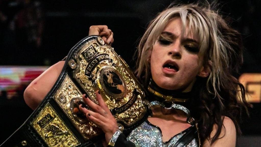 Jamie Hayter holds up the AEW Women's Championship, which she won at Full Gear 2022