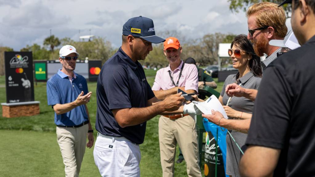 Jason Day signs autographs during the Arnold Palmer Invitational practice rounds