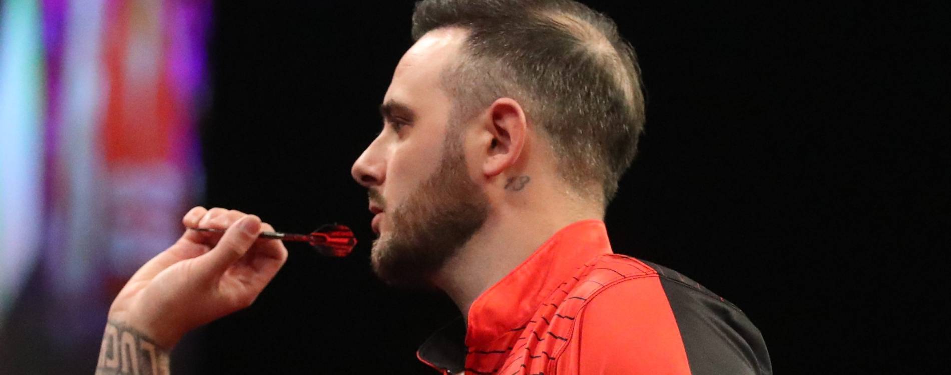 Joe Cullen competing at a Premier League Darts event