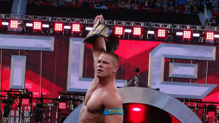 John Cena raises a title belt