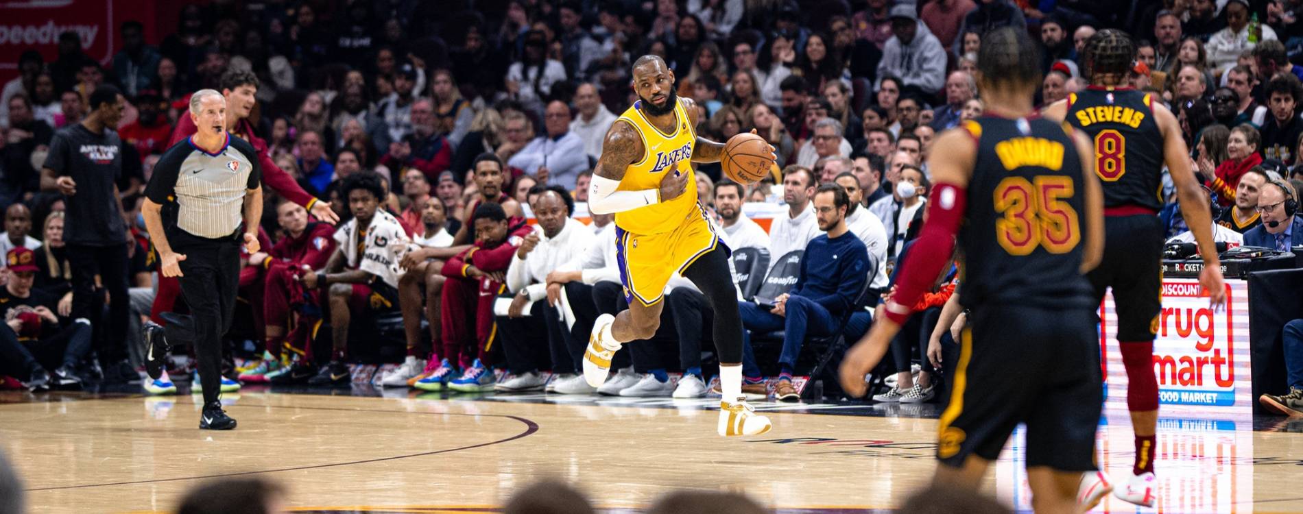 LeBron James carries the ball up the court