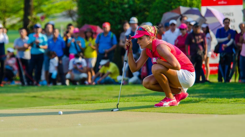 LPGA Tour player Lexi Thompson lines up a putt