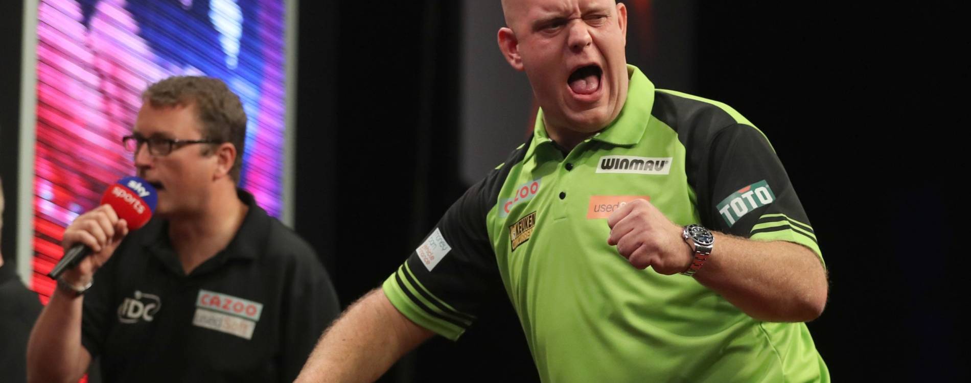 Michael van Gerwen celebrates at a Premier League Darts event