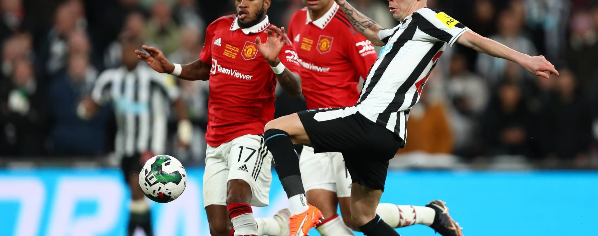 Miguel Almiron and Fred contest the ball in the Carabao Cup final