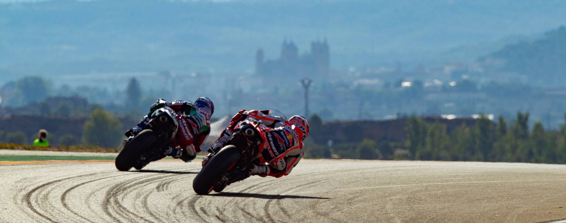 MotoGP riders enter a corner at MotorLand Aragón