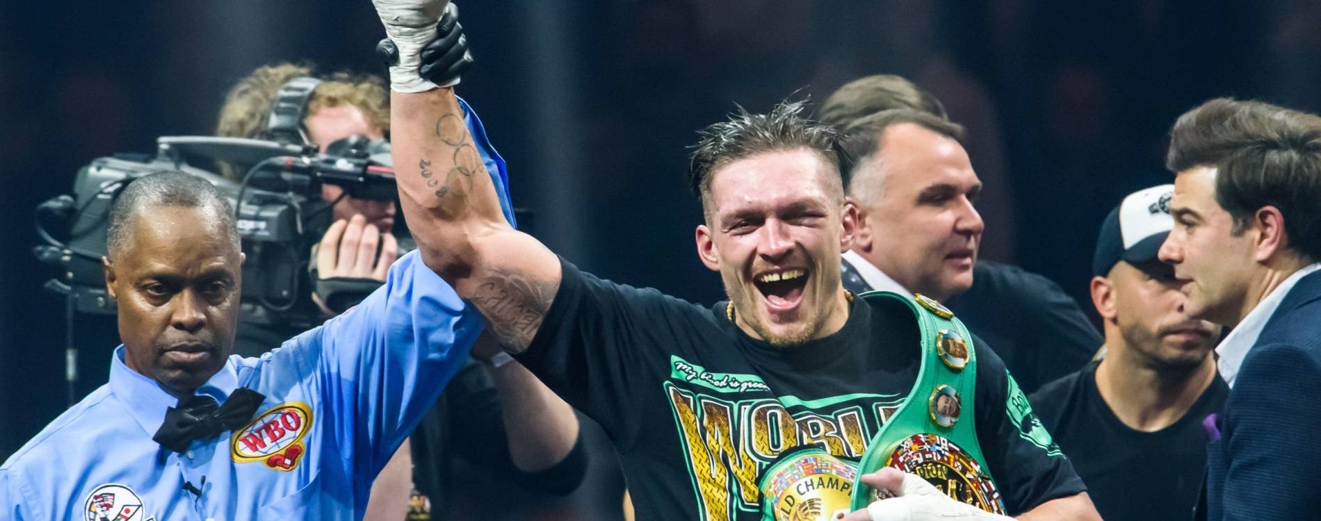 Oleksandr Usyk's arm is raise after another victory