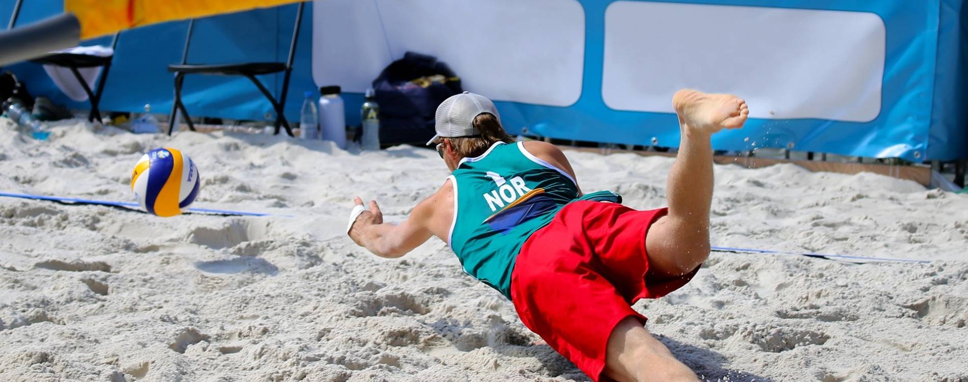 Player dives for the ball