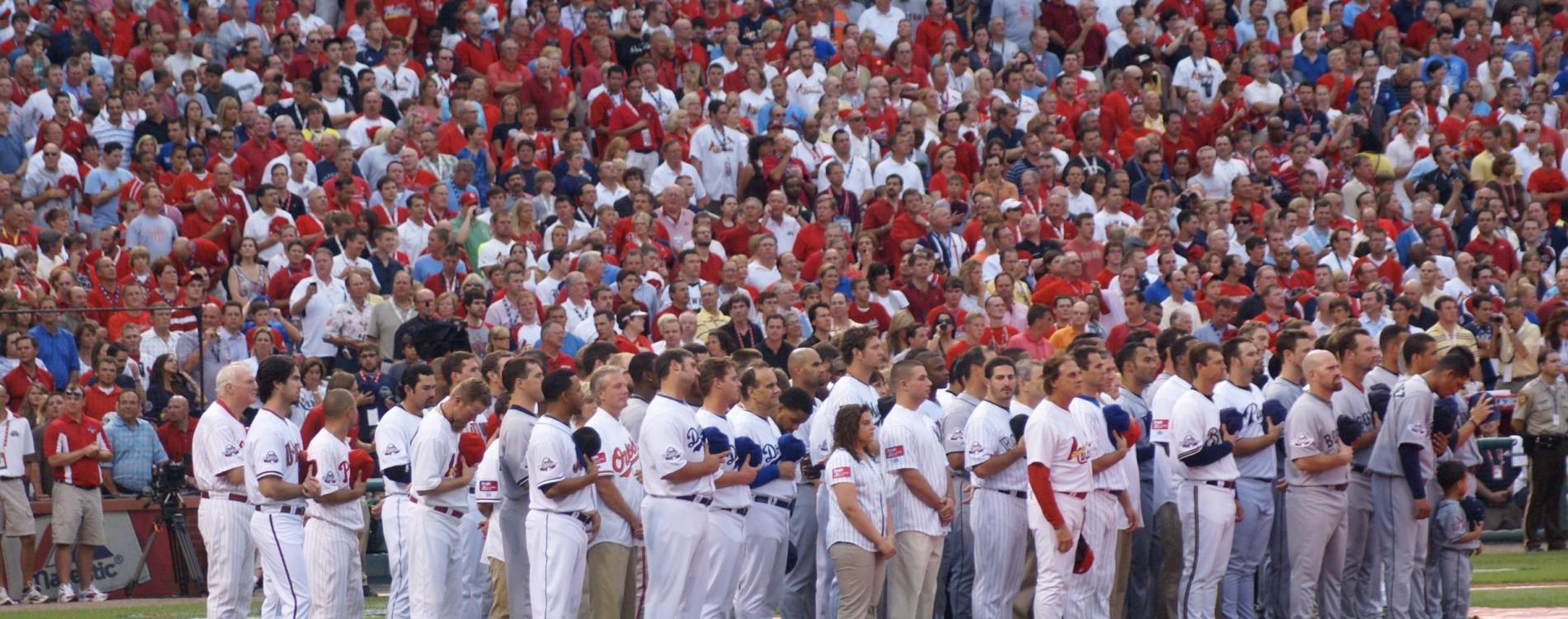 Players stand for the national anthem at the MLB All-Star Game