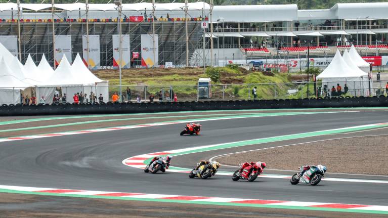 Riders taken on a corner at Mandalika International Street Circuit
