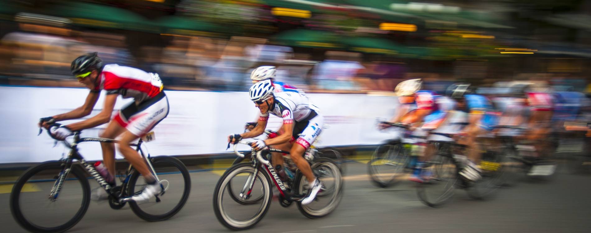 Road cyclists speed by