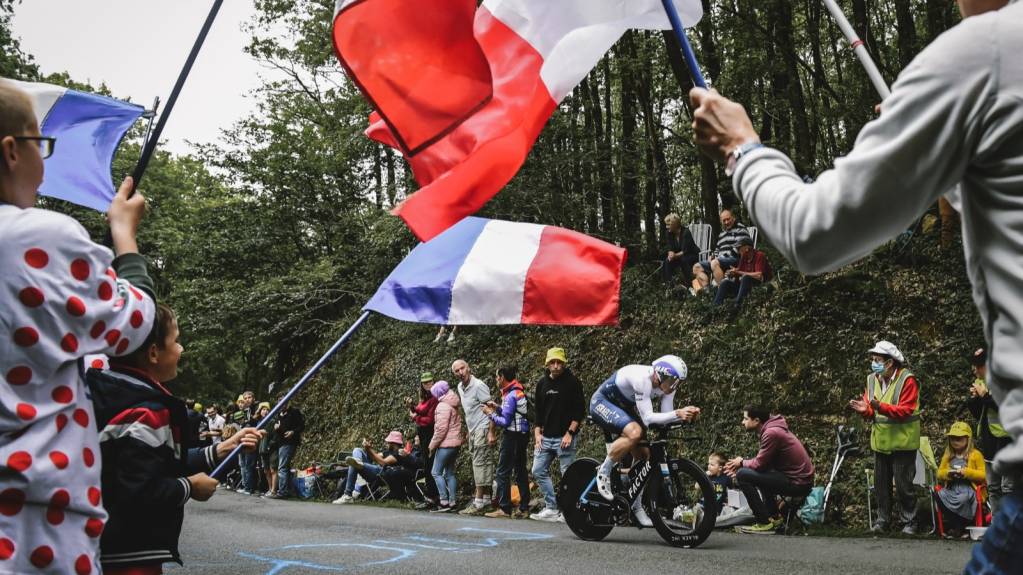 Roadside Spectators Watch the Riders Pass