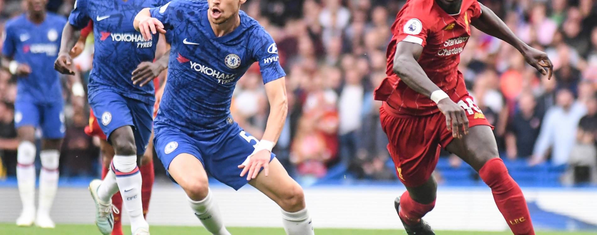 Sadio Mane and Jorginho compete for the ball