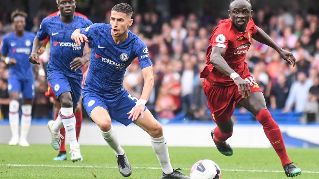 Sadio Mane and Jorginho compete for the ball