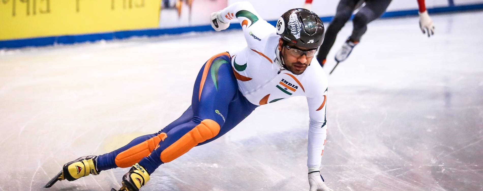 Short-Track Speed Skater races round the bend