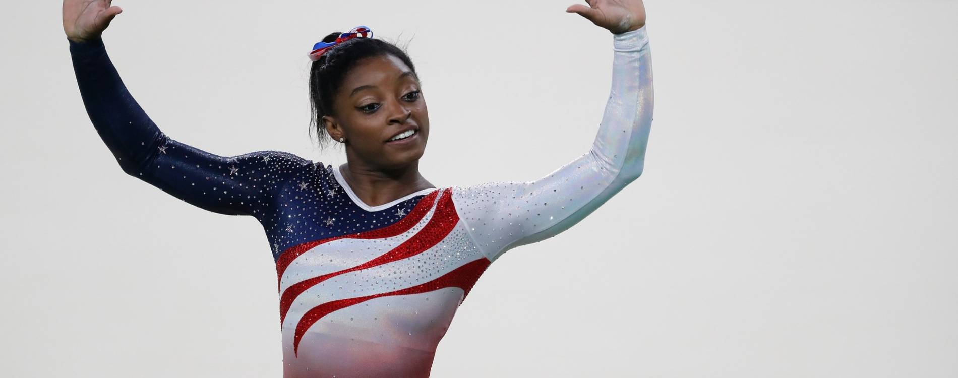 Simone Biles waves to crowd