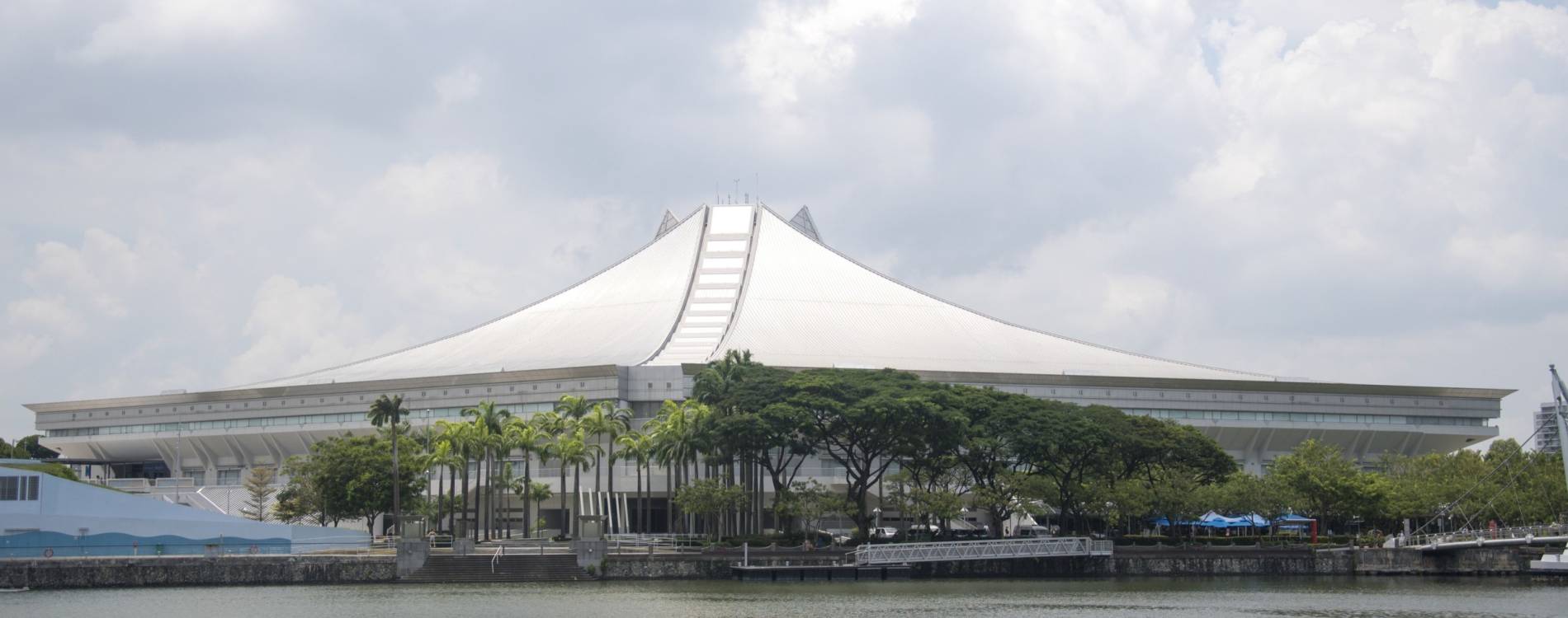 Singapore Indoor Stadium, with the Geylang River in the foreground