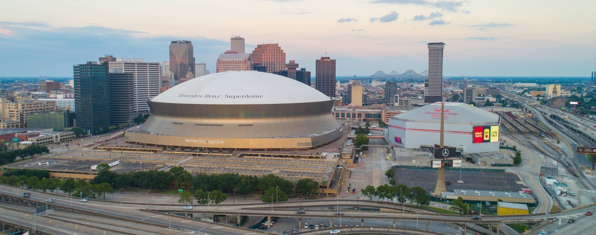 Smoothie King Center on the left and Caesars Superdome on the right